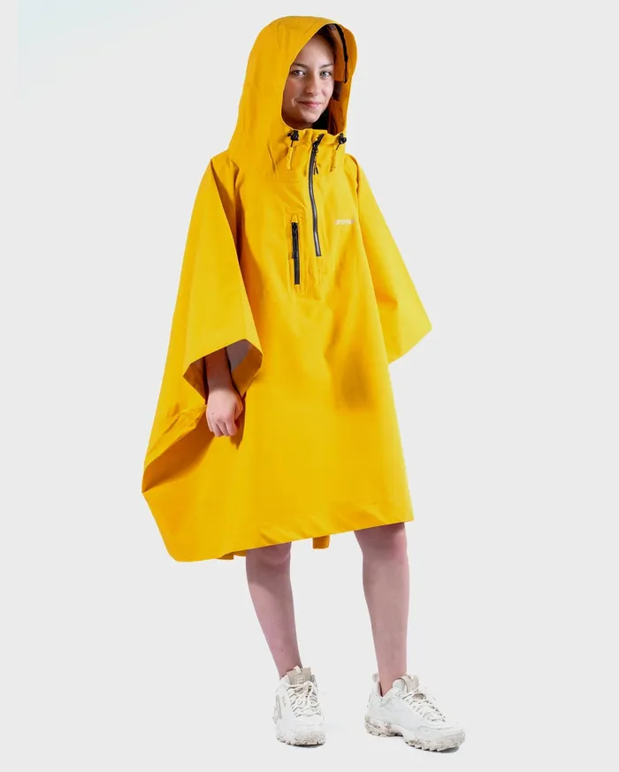 Child wearing a yellow rainproof poncho